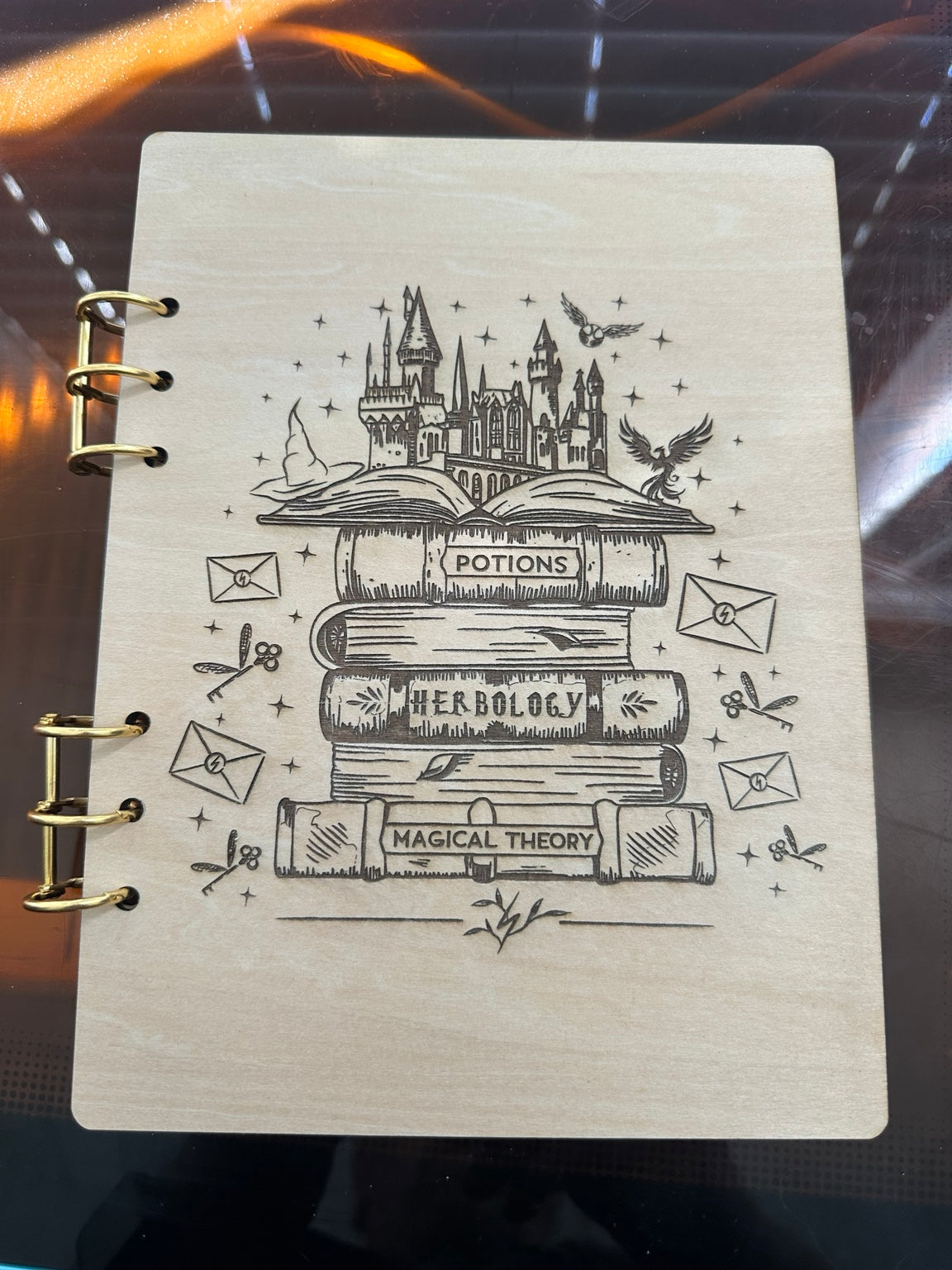 A5 basswood notebook with laser engraved magical books and castle design