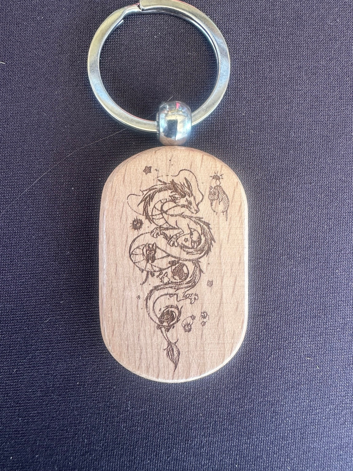 Laser engraved wooden keychain with dragon design