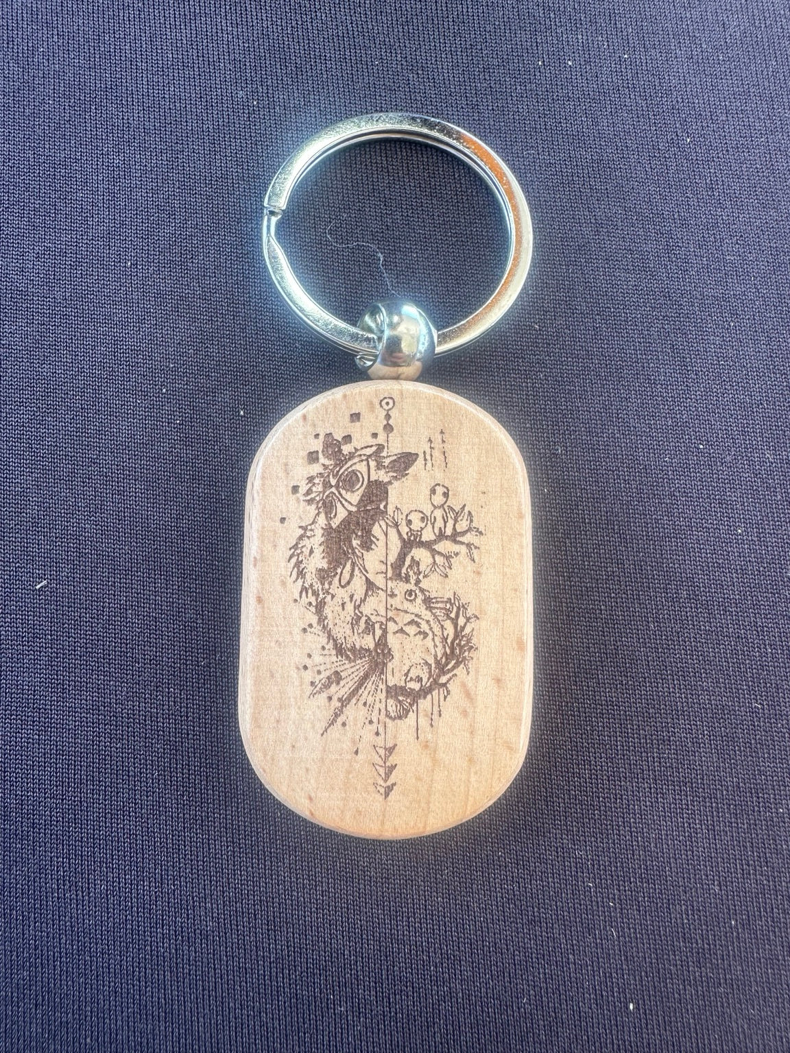 Laser engraved wooden keychain with plague doctor design