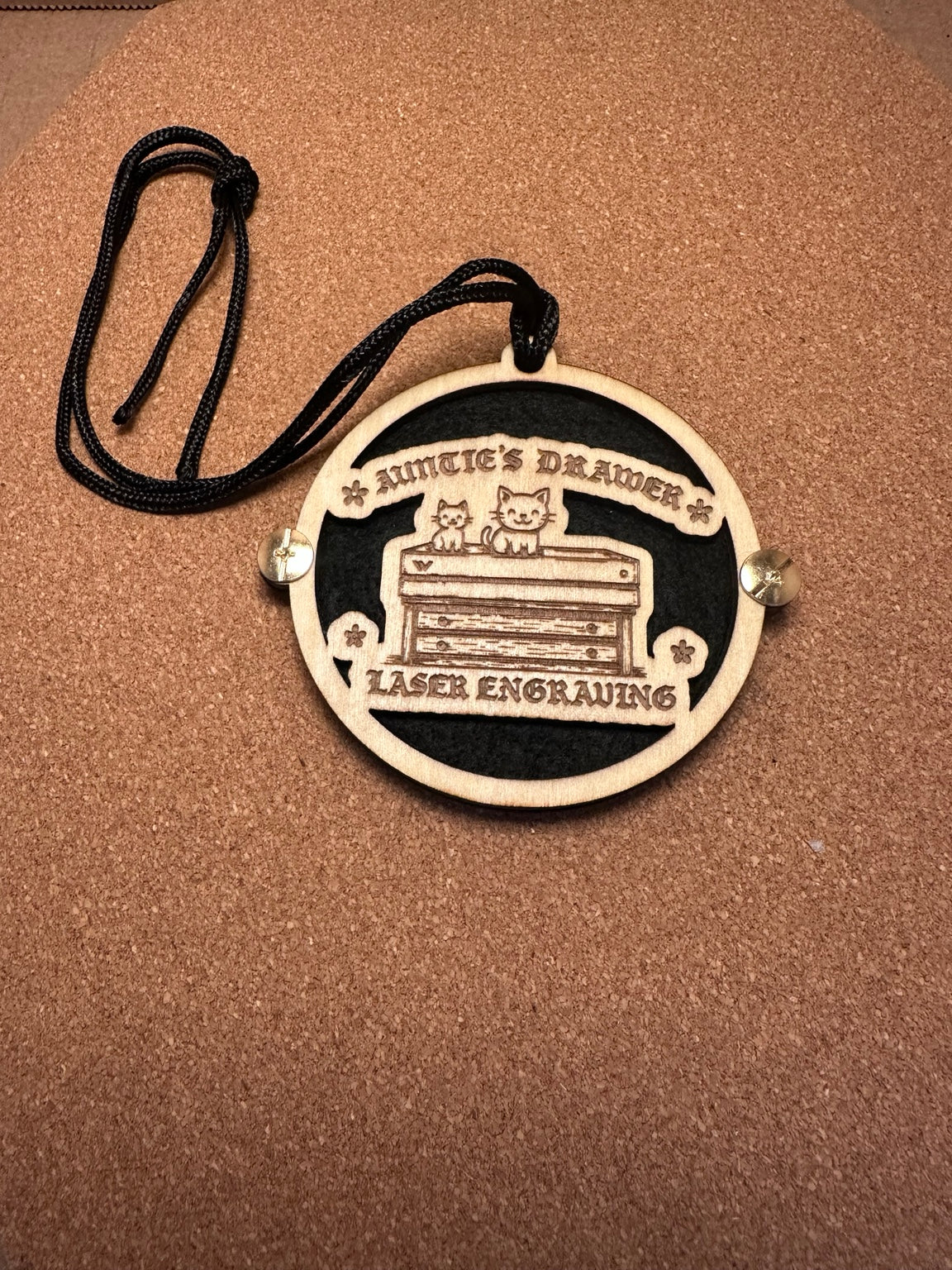 Custom laser cut and engraved basswood essential oil car freshener with Annacie's Drawer design and black felt backing