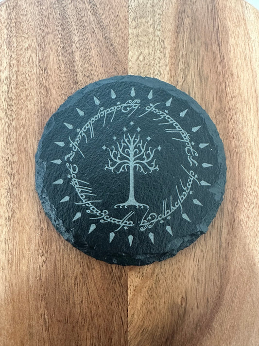 Laser engraved slate coaster with fantasy tree and circular script design